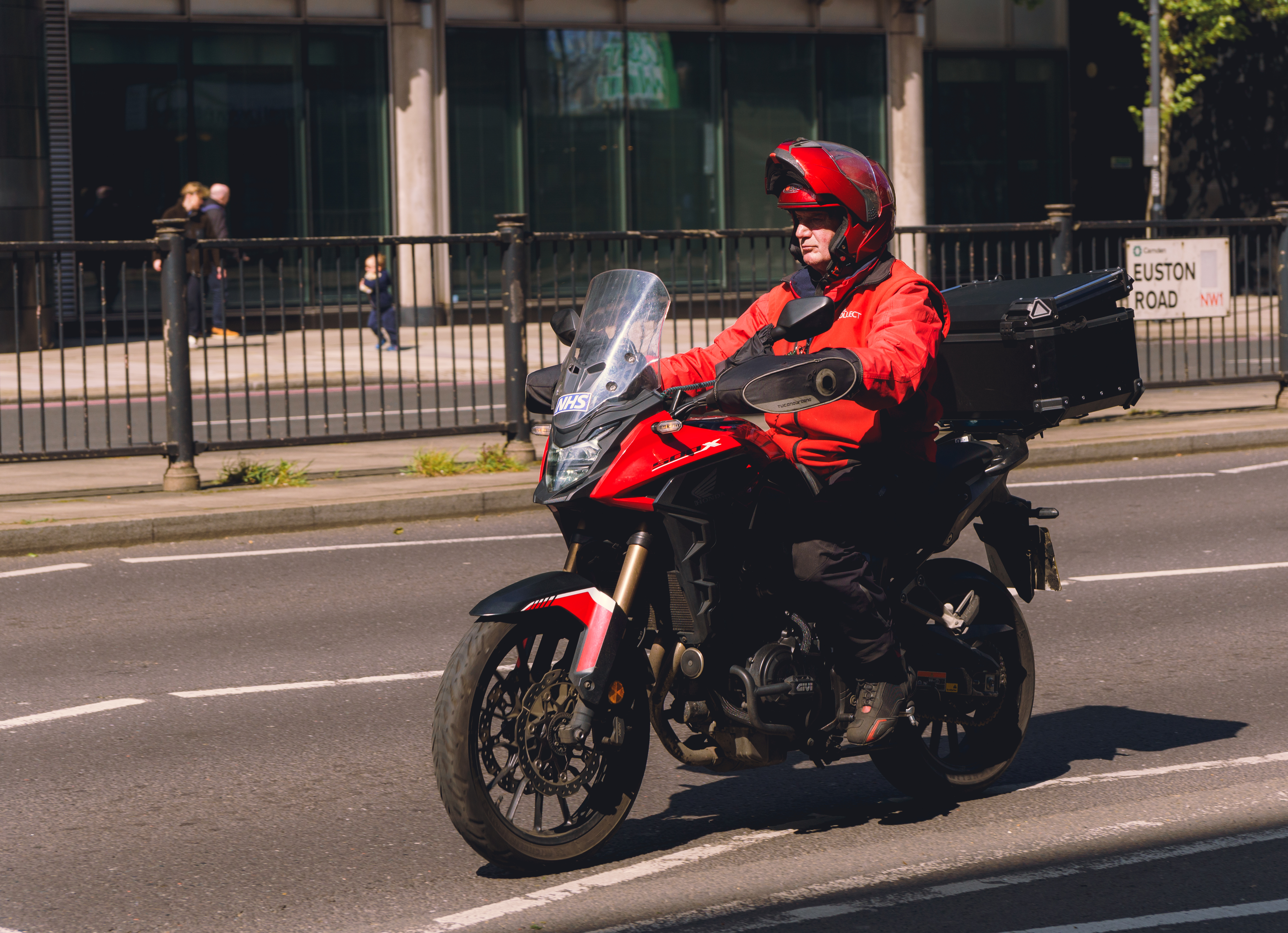 Man In Red On Motorcycle